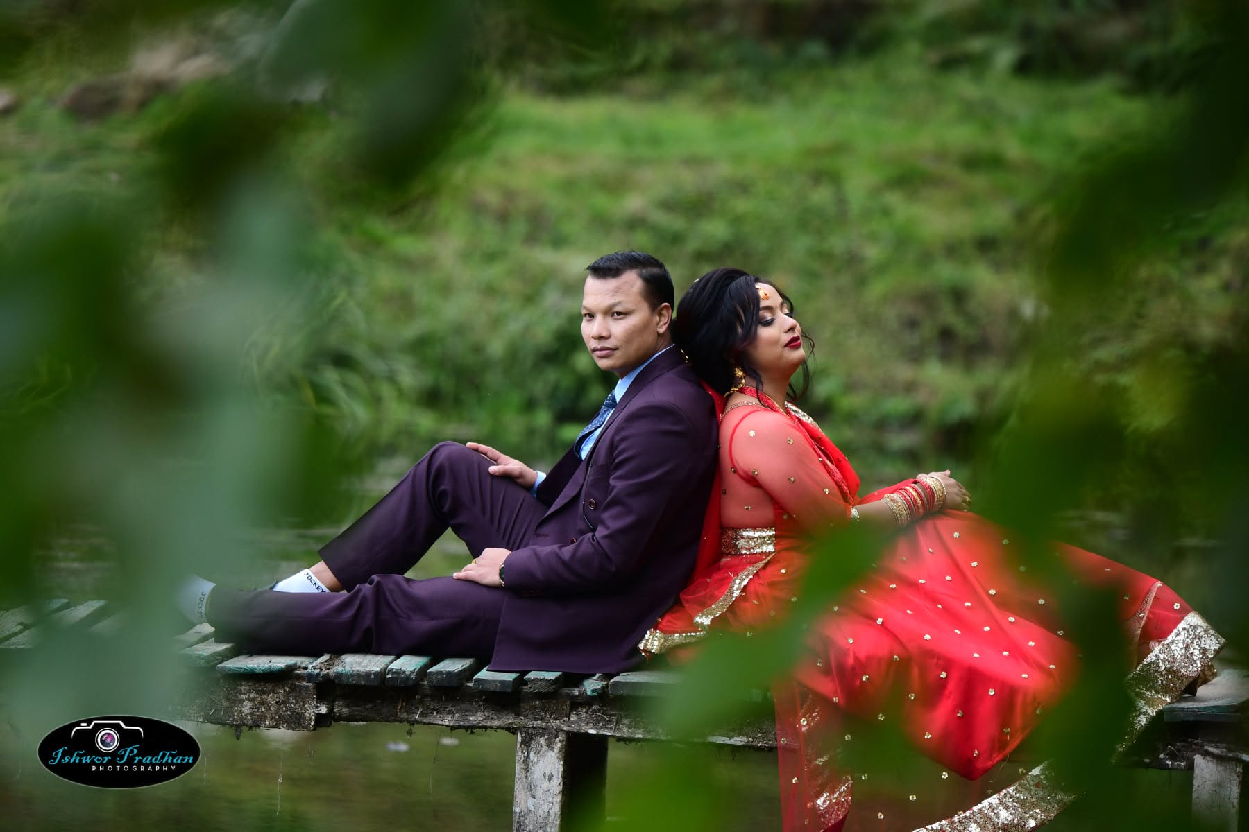 Pre-wedding couple portrait beside a pond