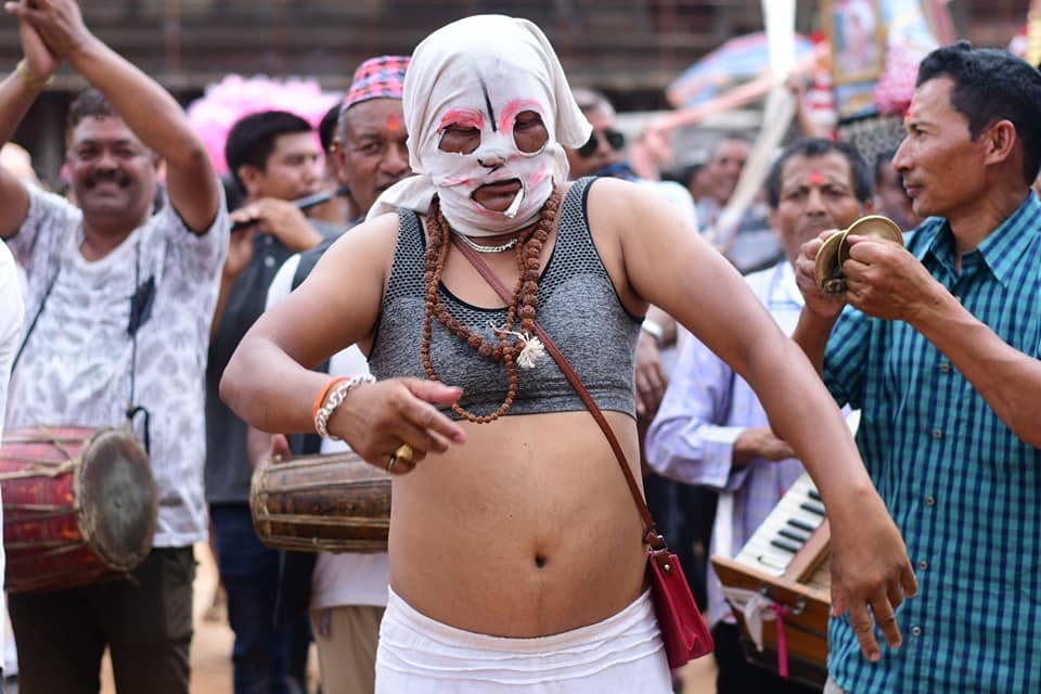 Traditional masked dancer performing at a festival in Bhaktapur